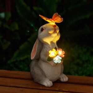 Garden rabbit holding a flower